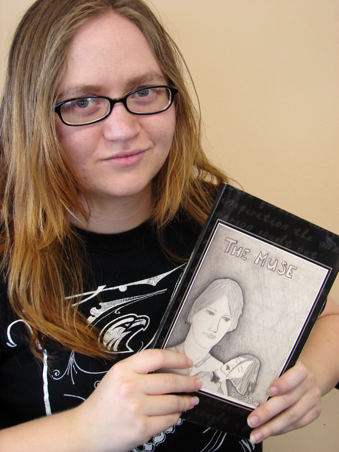 ULM student Kris Ivy poses with her recently published book