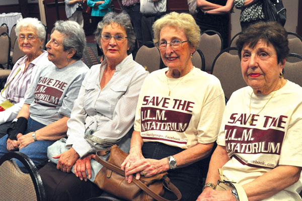 Members of the community come to show their support at the public unveiling of plans for the Natatorium. Many sport the “Save the U.L.M. Natatorium” T-shirts provided by the pool’s supporters.
