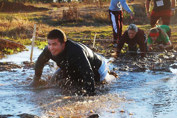 Dash competitors crawl through obstacles for fundraiser.