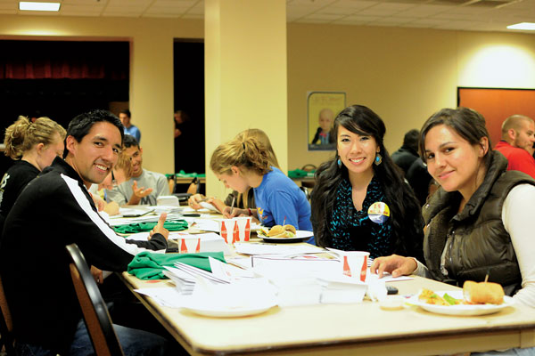 Fernando Cordova (left,) Erica Nguyen (middle) and Victoria Miller (right) write letters Thursday night encouraging their friends and family to donate to St. Jude’s hospital as part of Up ‘til Dawn’s annual letter writing event.