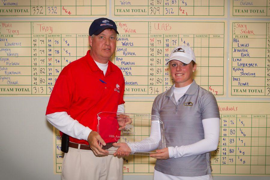 Lina Lagergren poses with her trophy at the USA Womens Invitational. She placed first at the tournament, beating her previous record in the process