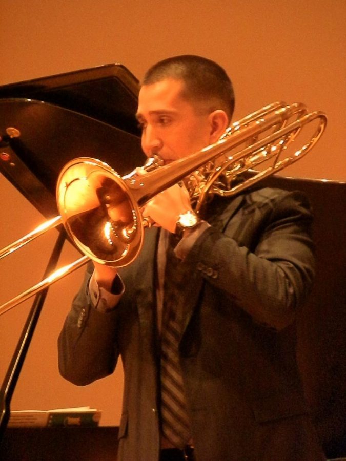 Guest sergeant plays trombone at FACS recital 