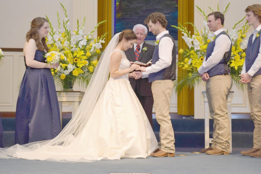 Amanda Gibson exchanges vows with Ryan Gibson at their March 21 wedding.
