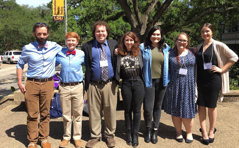 From left to right: Dr. Will Rogers, Benjamin Rhodes, Cooper Doyle, Anastasia Hanson, Mac Cramer, Kimmy Doughty, and Mary Katherine Hillman at the LSU Discovery Day Undergraduate Research Conference in Baton Rouge.