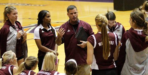 Coach Hiltz talks over his adjustments during a timeout with his team last season.