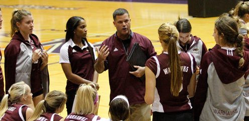 Coach Hiltz talks over his adjustments during a timeout with his team last season.  