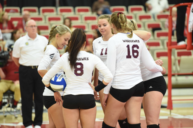 The team huddles during a match in Arkansas. 