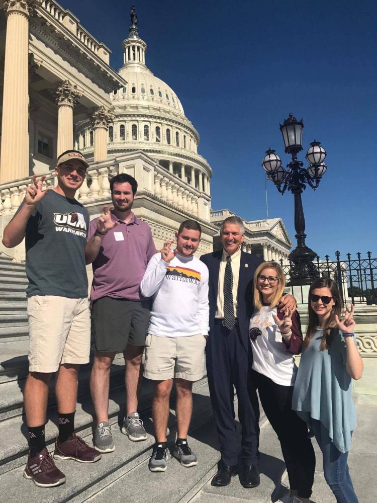 TALONS OUT IN D.C.: SGA officers posing with their talons out in a photo with Representative Ralph Abraham.