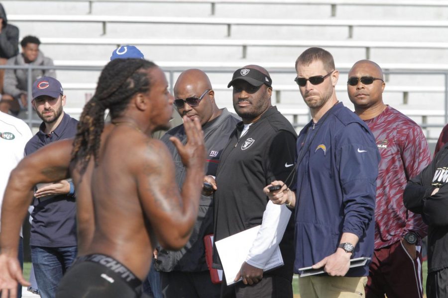 NFL scouts drill football players at pro day