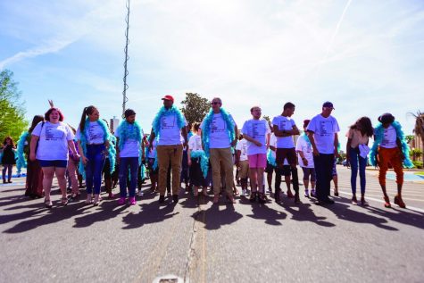 Annual march speaks for victims: Men swap sneakers for heels to fight sexual violence