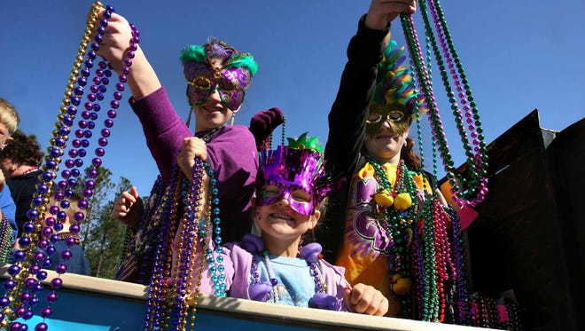 why throw beads at mardi gras