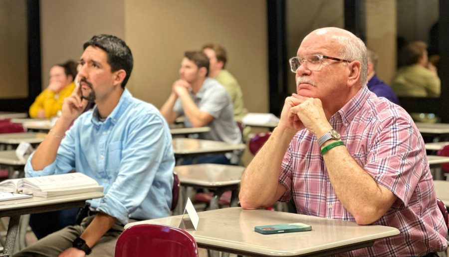 Former priest joins faculty, students for ethics class