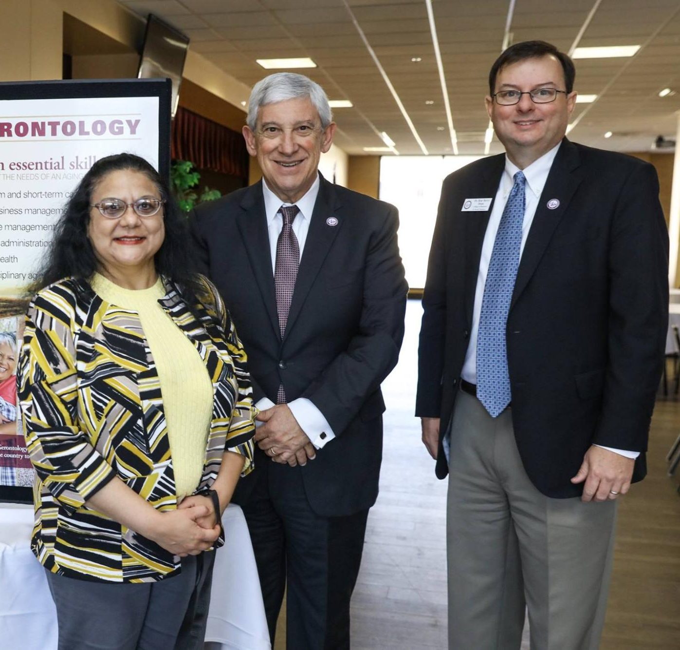 Anita Sharma promotes ULM Gero Institute alongside President Ron Berry. 