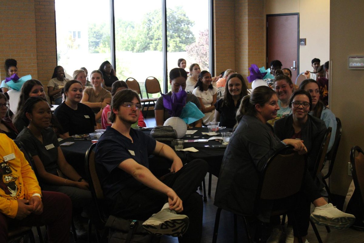 ATTENTIVE AUDIENCE: Students listen as Daniels explains suicide awareness is important.