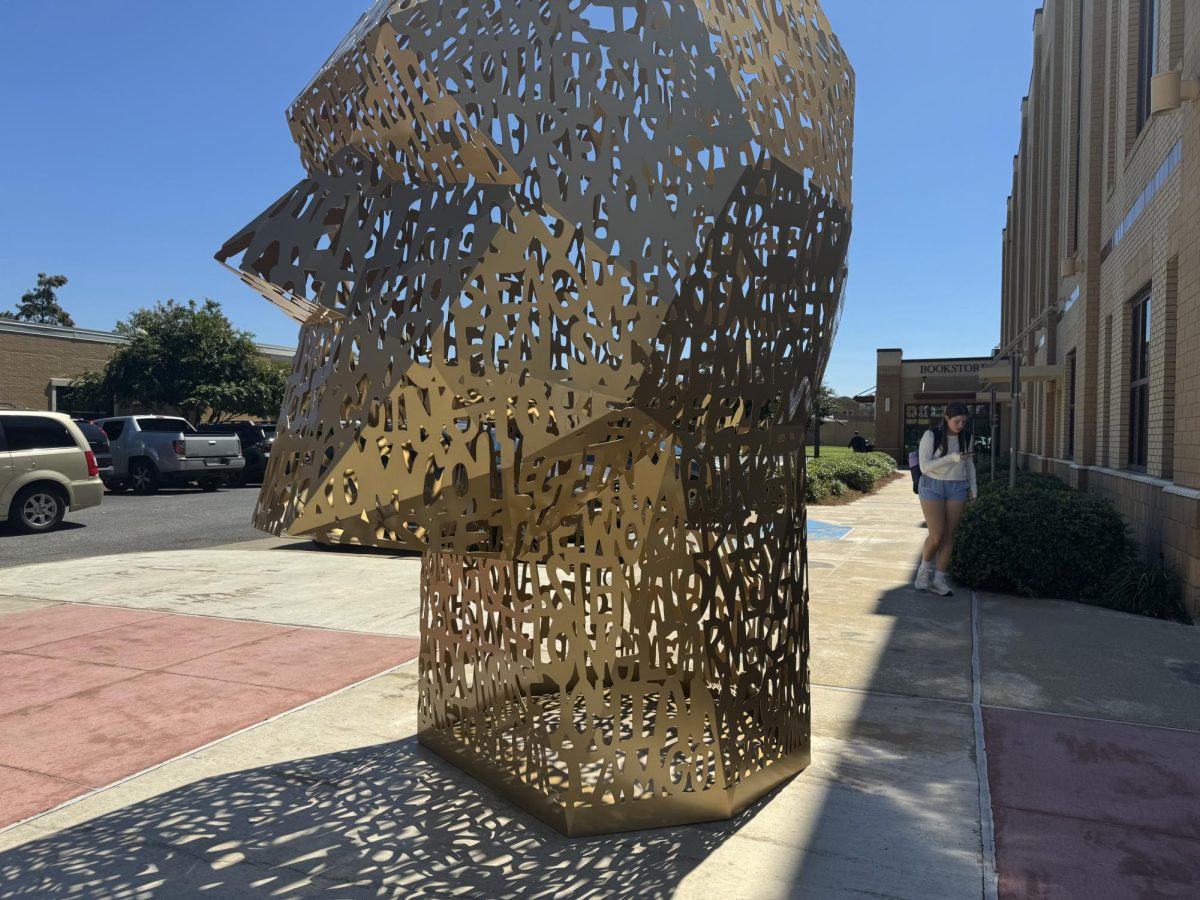 HEADING IN THE WRONG DIRECTION: The sculpture sits on the sidewalk between Sandel Hall and the bookstore. 