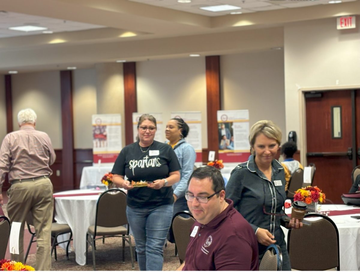 BAGELS AND BUSINESS: Counselors enjoy their complimentary breakfast while networking with ULM staff.