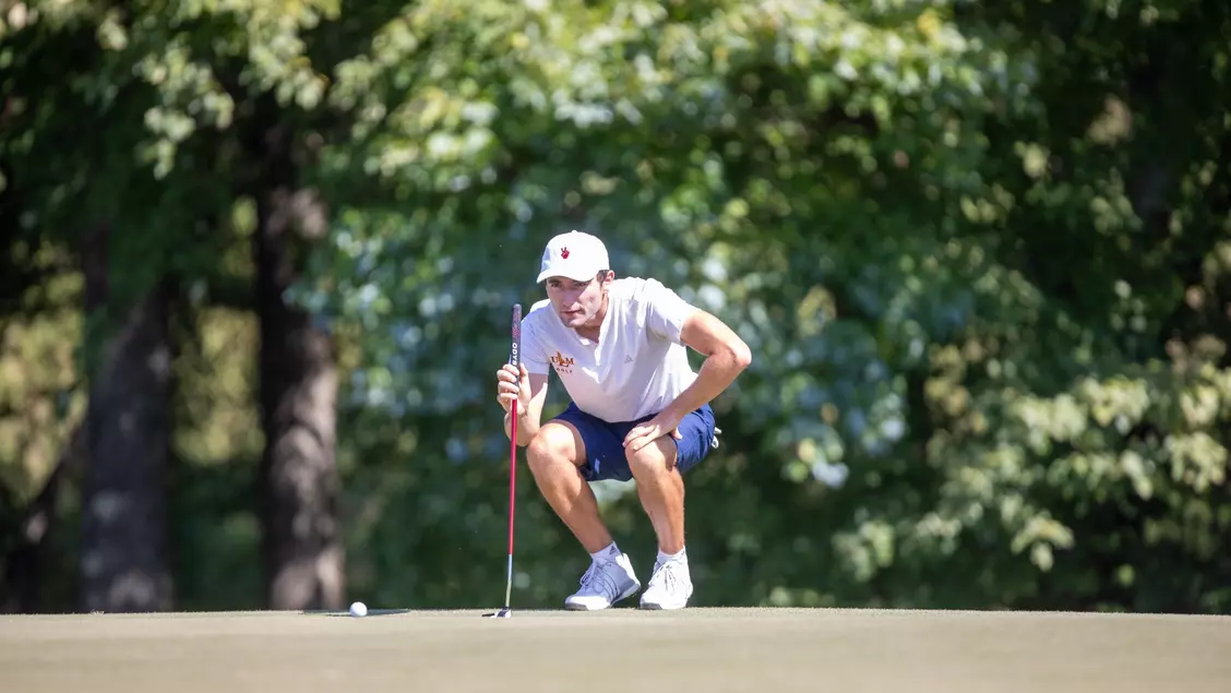 EYE ON THE PRIZE: Louis Anceaux carefully lines up his shot during the Bayou City Collegiate Classic. 