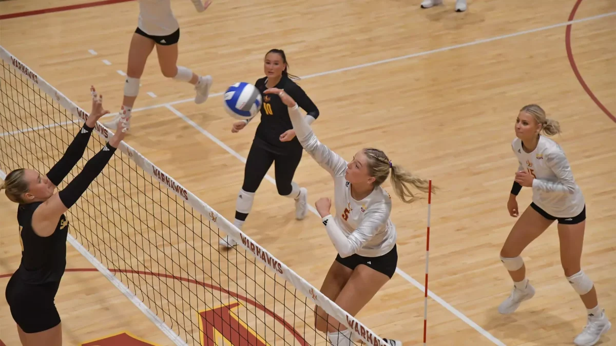 KILLING THE GAME: Middle Blocker Hannah Redrow goes in for a spike. 