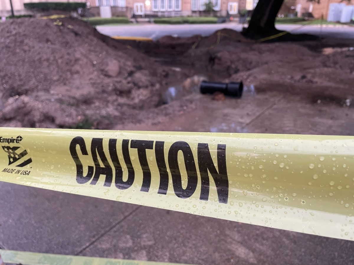 WATCH  YOUR STEP: Maintenance staff clears debris and cement to repair the gas leak near Walker Hall. 