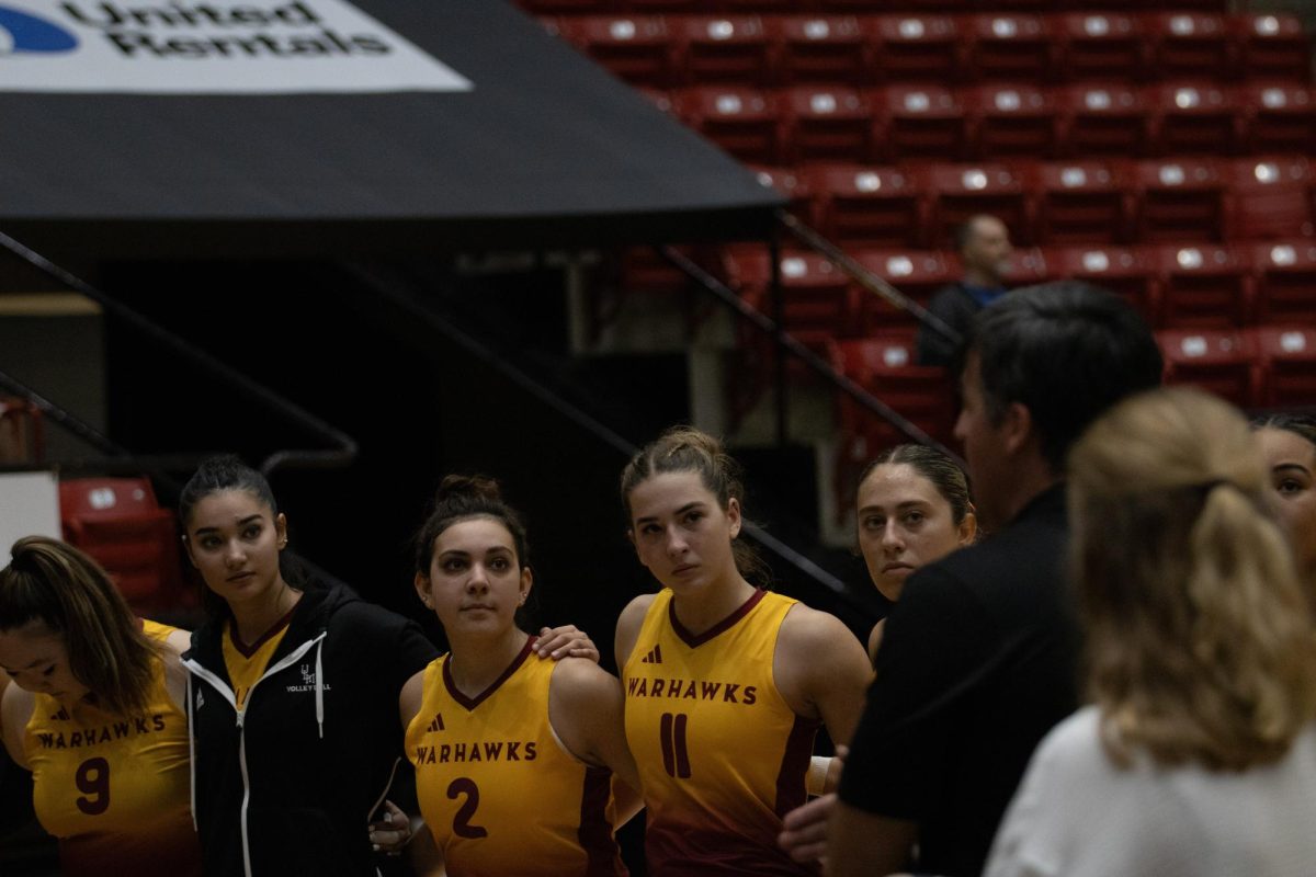 (From left) ULM Warhawks player Kristine Bakhad(9),Beril Celik(20),Camryn Kimes(2) and Eden Pietrzak(16) listen to coach Ried Gann.