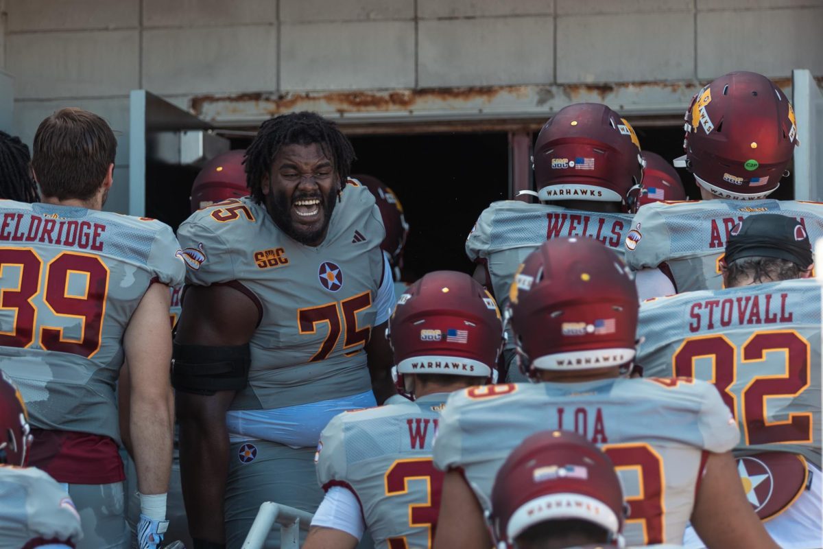 ULM offensive lineman Que McBroom (75) roars with emotion as the team enters the tunnel to head to the locker room for half time during the game against Arkansas State at Malone Stadium on Saturday, Sept. 27.