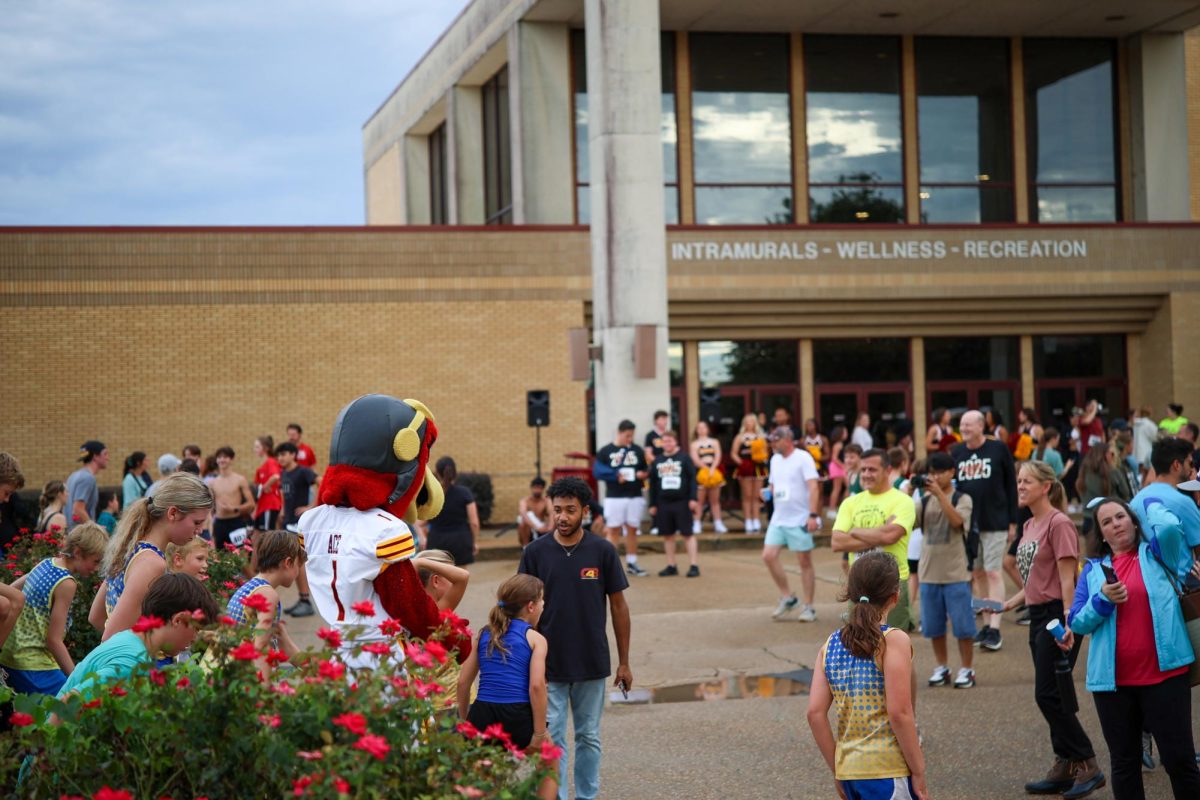 University Mile participants waiting for results in front of Activity Centre.