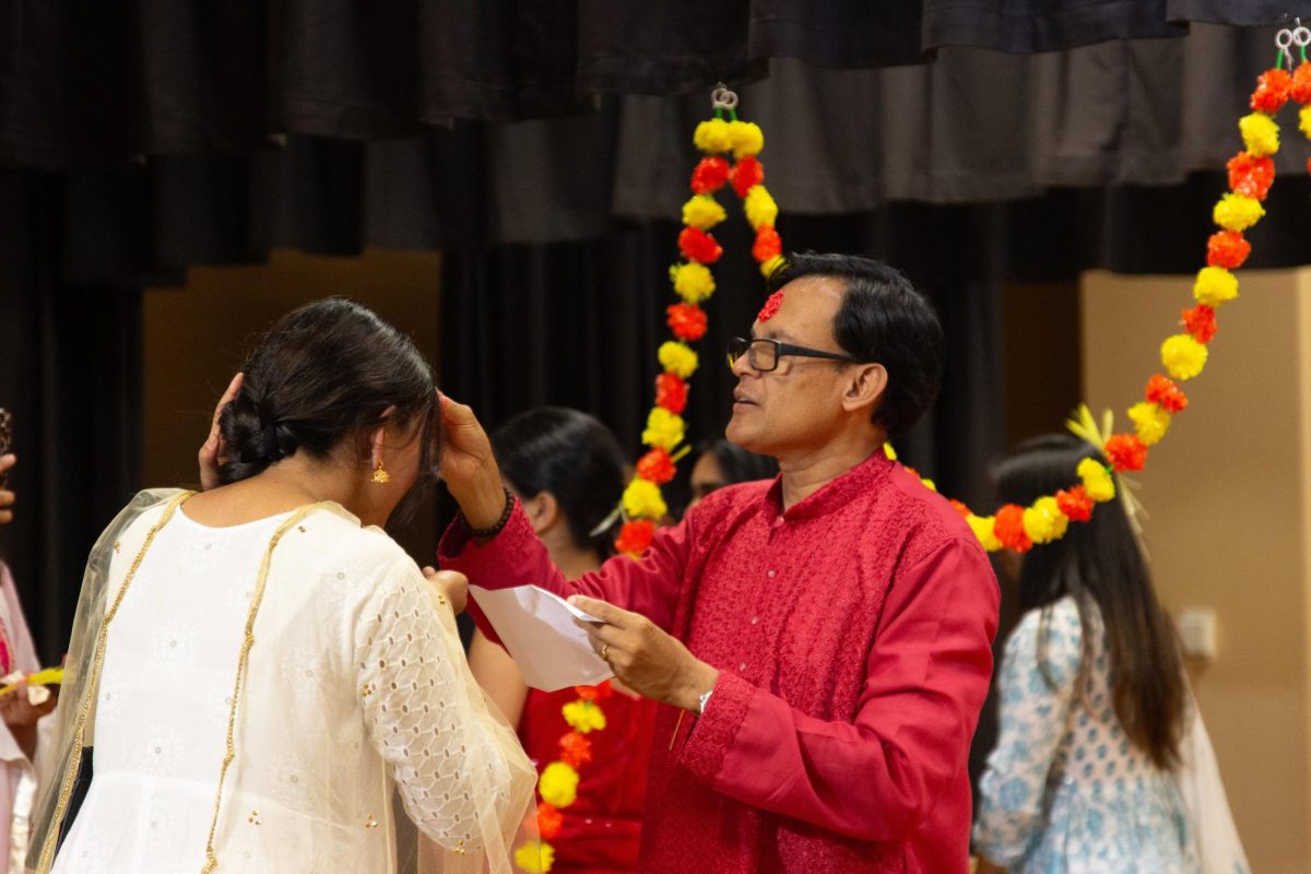 Nepalese student getting Tika to celebrate Dashain. 