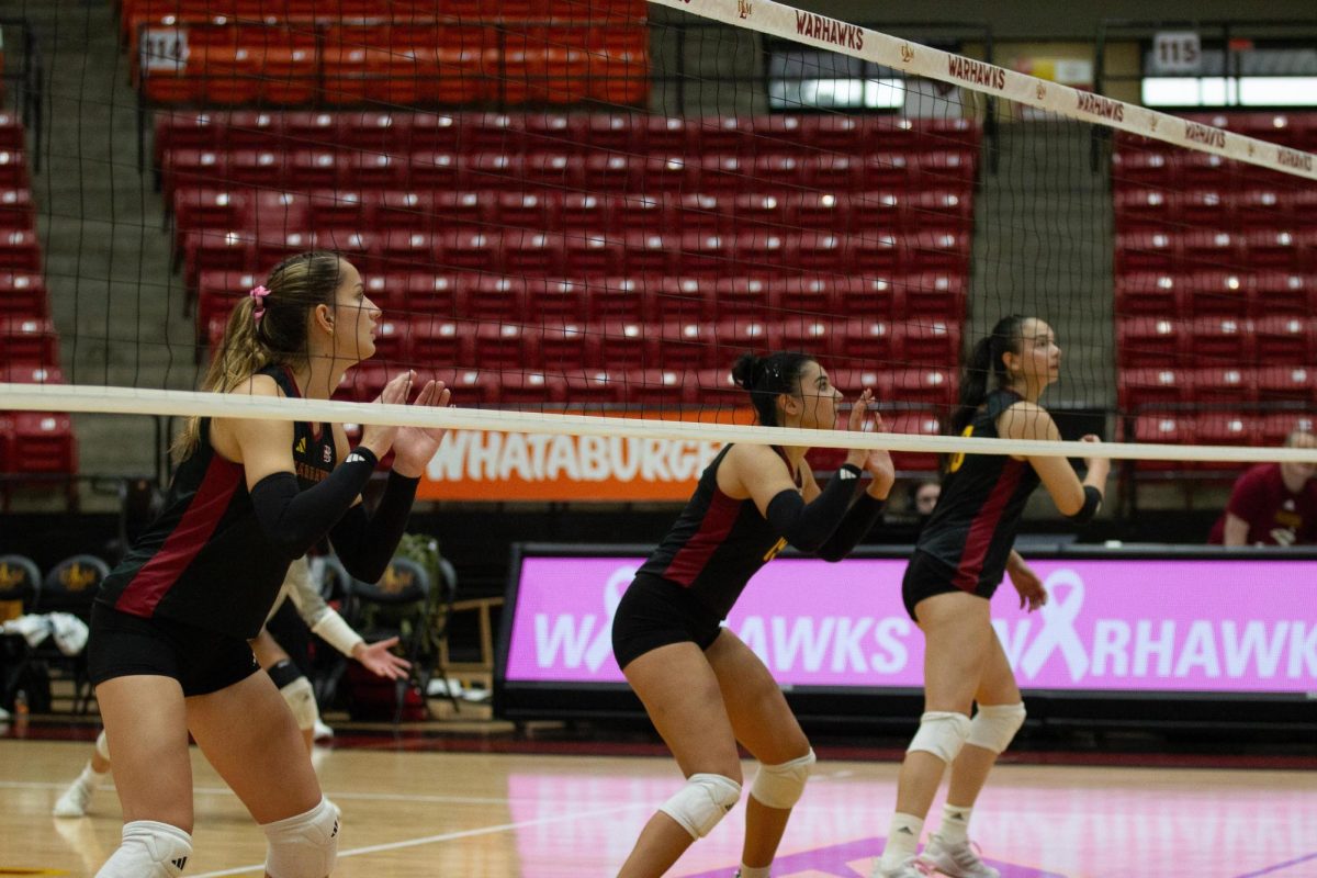 Front position players waiting to make a block against South Alabama.