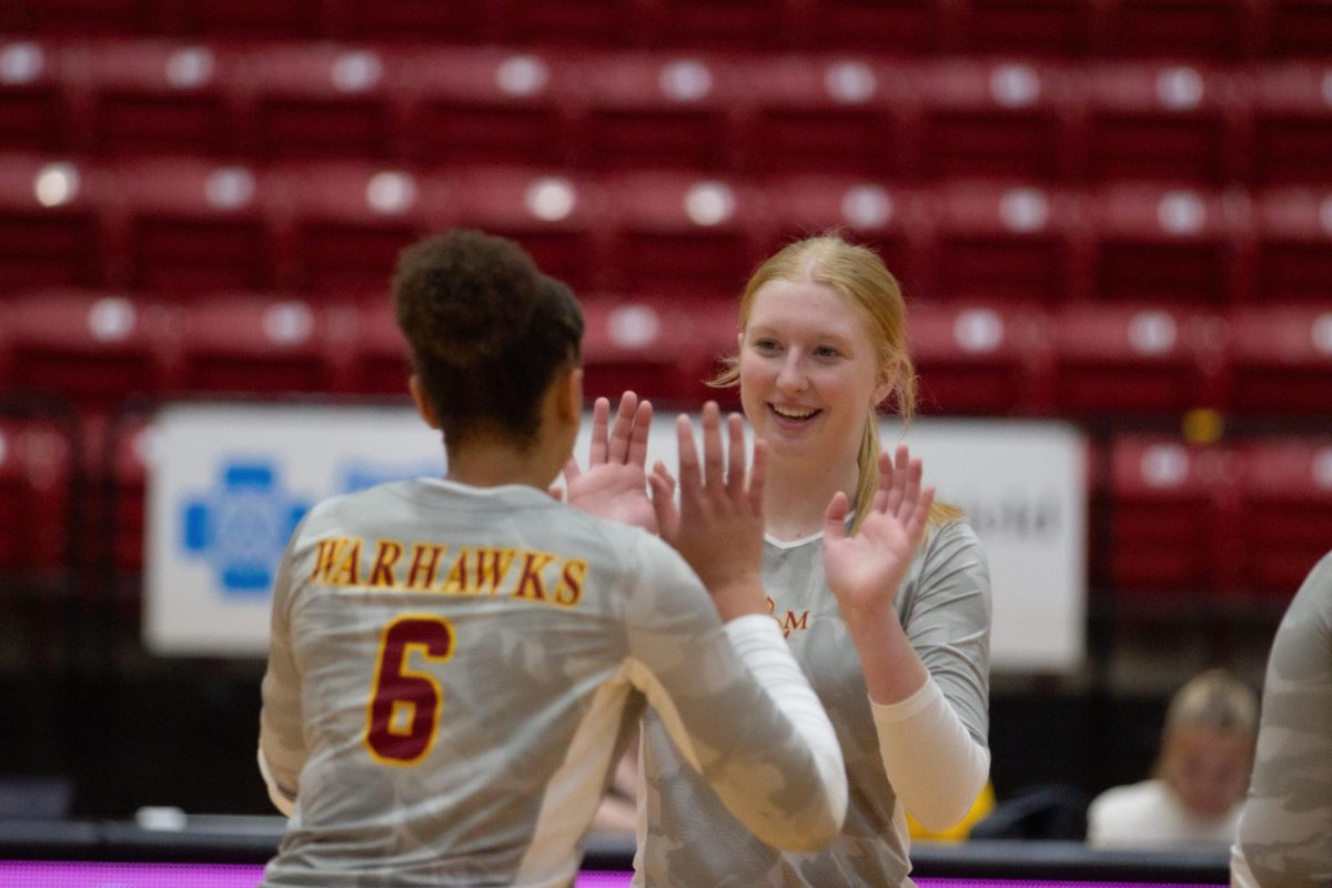 Kennedy Plummer and Aniya Hall celebrating the point. 
