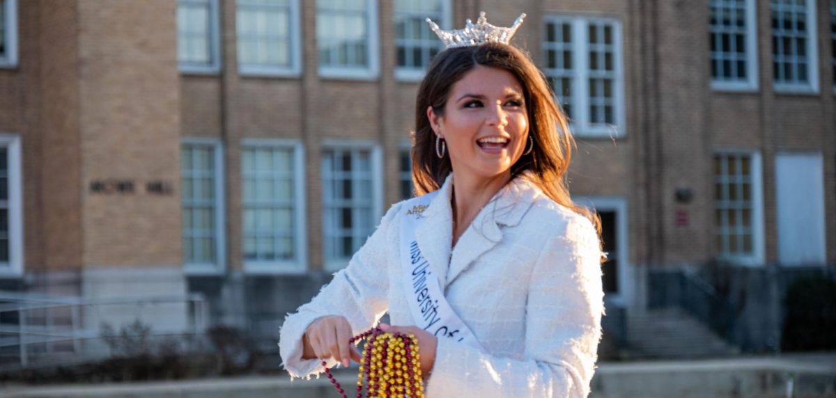 Miss ULM Katherine Mccullars throws red and gold beads on her float in the Mardi Gras Parade.  