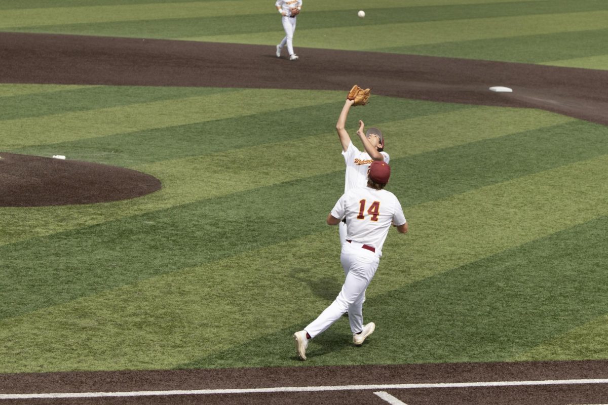 ULM baseball pitcher #26 JC Dermody catching a pop fly.