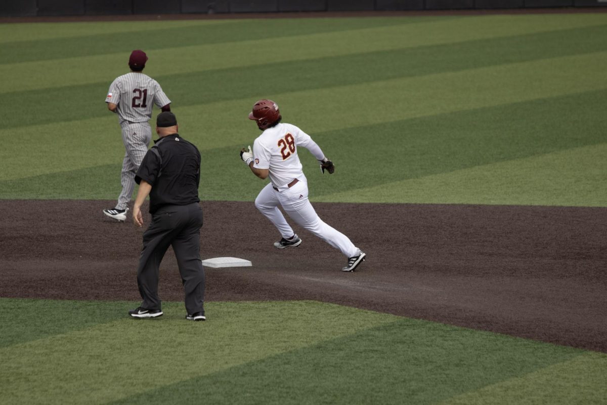 ULM baseball Catcher #28 Marcus Aranda running to second base.