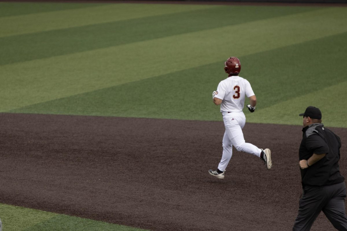 ULM baseball Catcher #3 Zach White running through the bases.