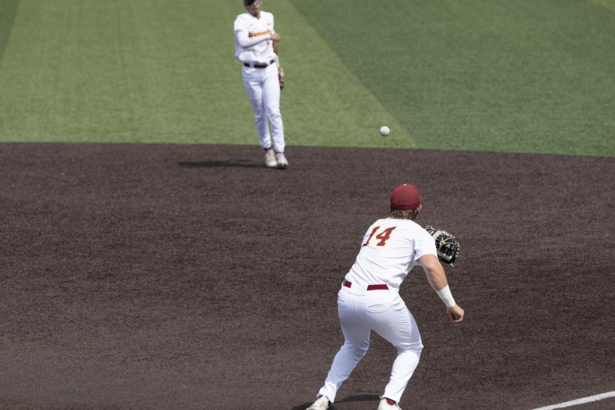 ULM baseball Infielder #14 Jake Haggard catching the ball at first base.
