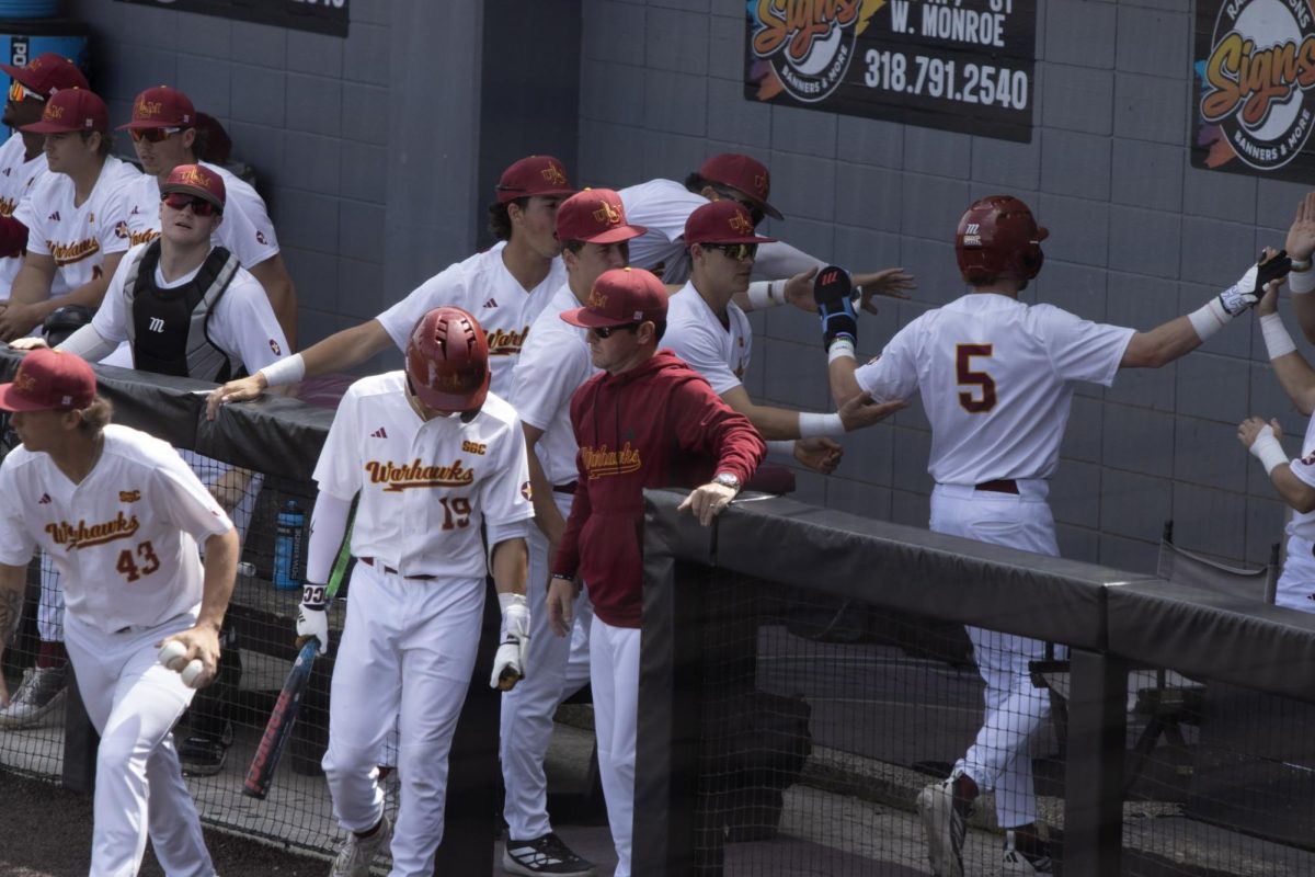 ULM baseball congratulating Outfielder #5 Davis Mauzy after an amazing play.