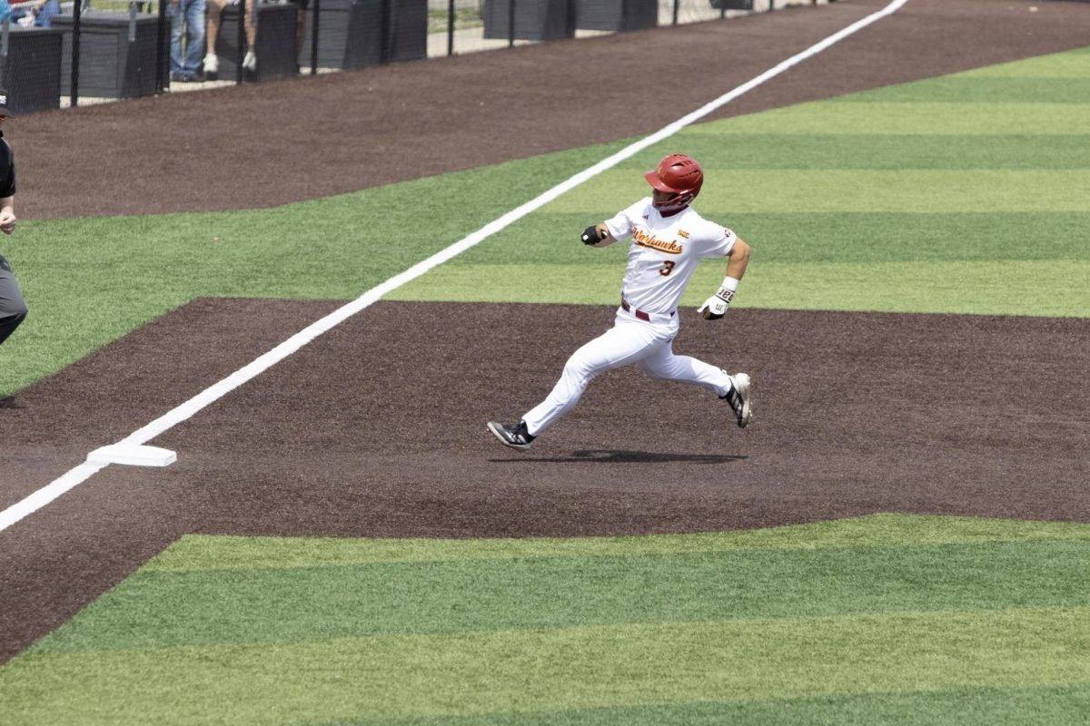 ULM baseball Catcher #3 Zach White running for third base.